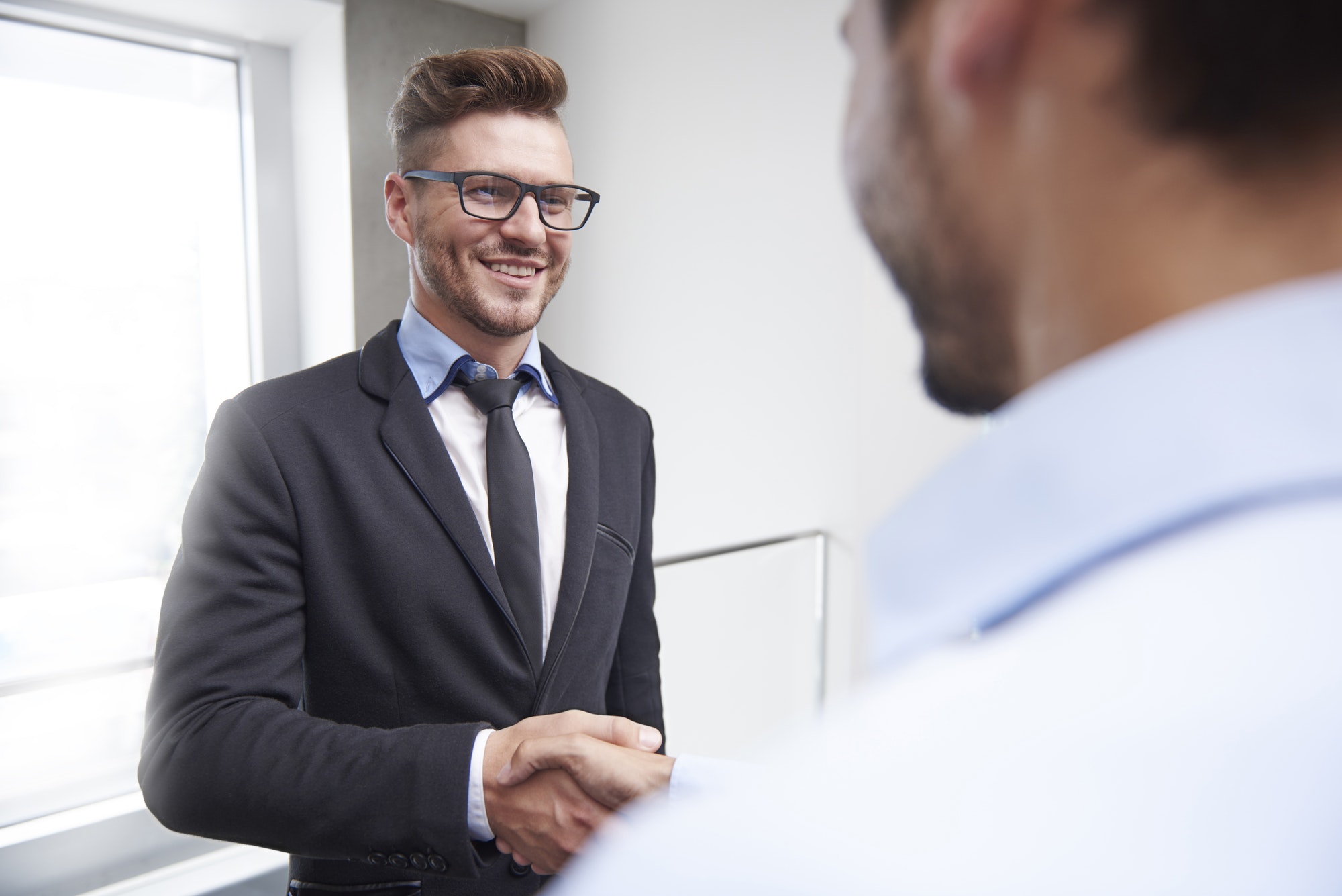 Agreement of two handsome businessmen