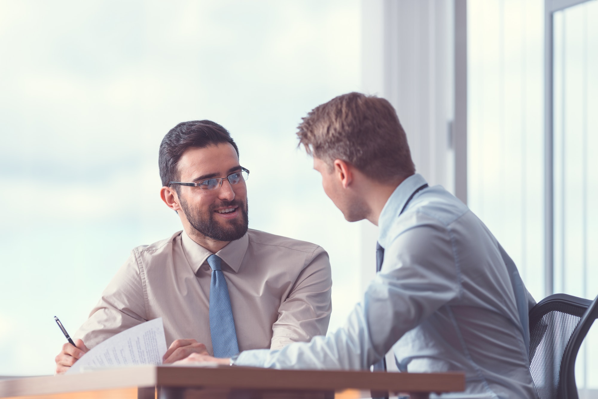 Smiling businessmen at the meeting